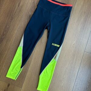 P.E Nation Black/Blue Leggings with Neon Yellow and Orange Accents